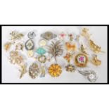 A large collection of vintage costume jewellery brooches ro include Art Deco, Marcasite, gilt,