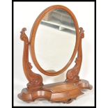 A 19th Century Victorian mahogany dressing table swing mirror of large form raised on oval base with