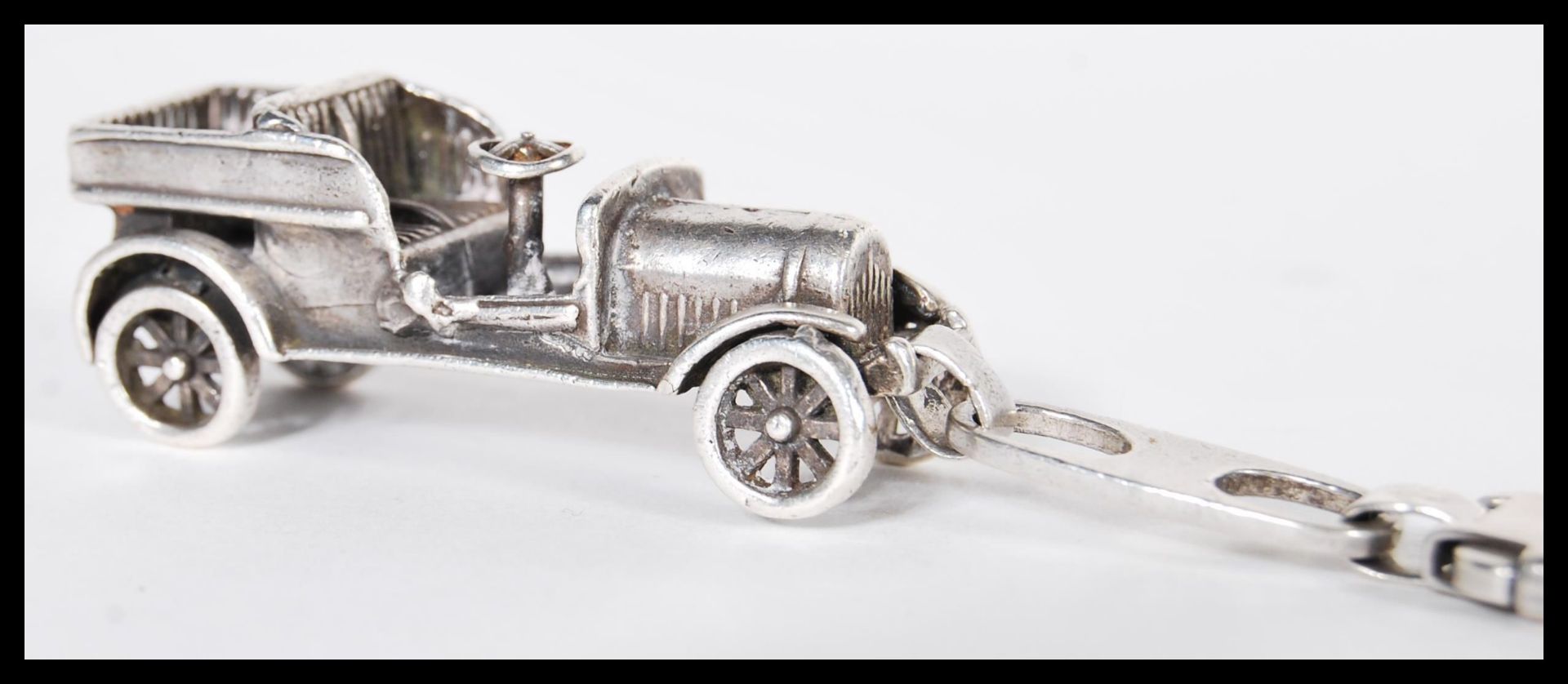 A sterling silver 925 clip pendant in the form of an early 20th Century classic old timer car.