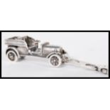 A sterling silver 925 clip pendant in the form of an early 20th Century classic old timer car.