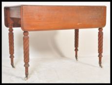 A 19th Century Victorian mahogany Pembroke dining table with hinged rounded rectangular top,