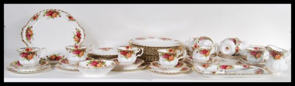 A Royal Albert tea service in the Old Country Roses pattern to include cups and saucers, dinner