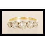 A stamped 18ct gold ring illusion set with five old cut diamonds. Weight 2.5g. Size O.