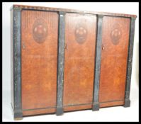 A large early 20th Century French amboyna wood and veined marble triple armoire wardrobe having