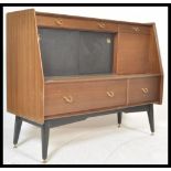 A 1970's G-Plan Librenza tola wood sideboard / credenza / highboard raised on an ebonised suspension