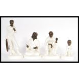 A collection of four Minton white porcelain and bronze figurines to include The Fisherman MS 13, The