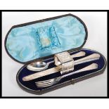 A silver hallmarked Victorian Christening cutlery set to include by Richard Martin & Ebenezer Hall