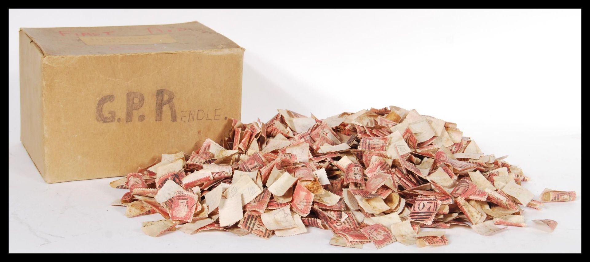 A large collection of loose 19th Century Victorian 1D Penny Red stamps loose in a WWII gas mask box,