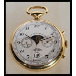 A vintage Gradus chronograph pocket watch having a white enamel dial with twin calendar apertures