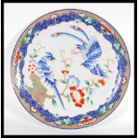 A 20th Century Chinese Republic period porcelain charger plate having hand painted decoration