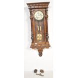 A 19th Century Victorian walnut ' Vienna ' regulator wall clock, the eight-day duration having a