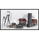 A collection of vintage 20th Century cameras to include a Vauxhall folding bellows camera, cased