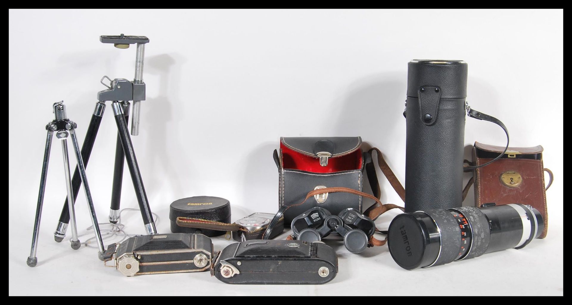 A collection of vintage 20th Century cameras to include a Vauxhall folding bellows camera, cased