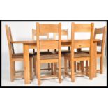 A contemporary large extendable oak dining table in the manner of Oak Furniture land  together