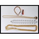 A collection of yellow metal items to include a long plated rope twist chain, length 106cms long,