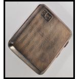 An early 20th Century hallmarked silver cigarette case by E J Trevitt & Sons of rectangular form