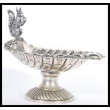 An early 20th Century silver plated electroplated Nut Dish The scallop-shaped bowl with embossed