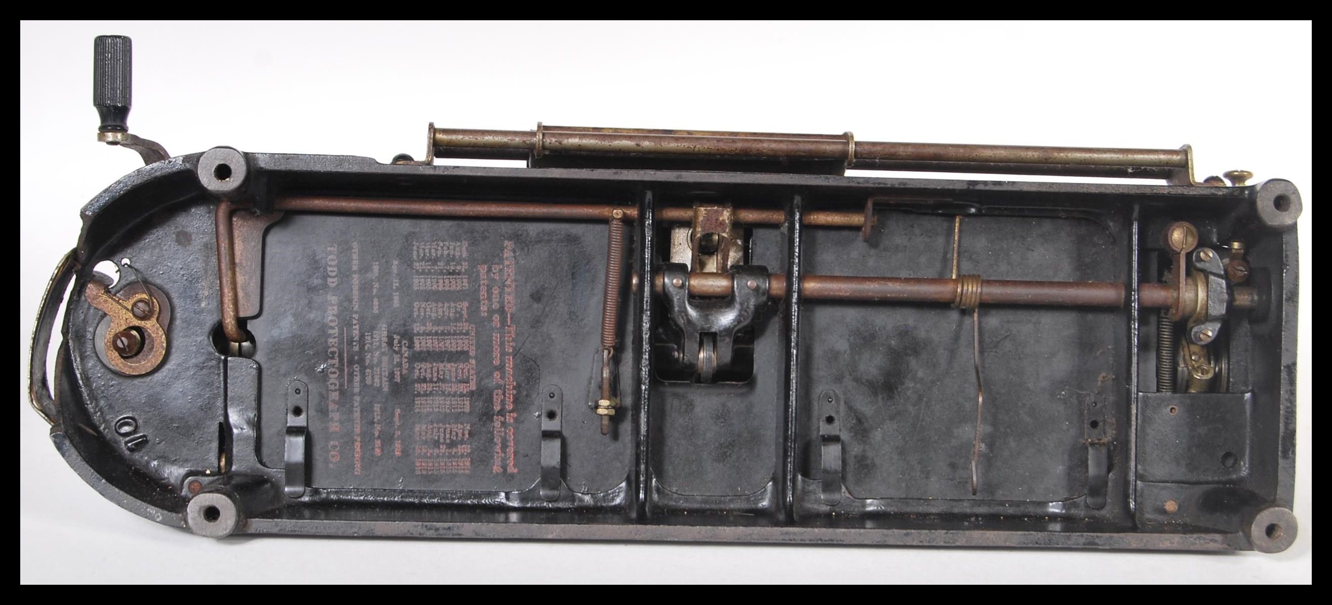 An early 20th Century vintage industrial Protectograph Cheque Writer machine having a black enamel - Image 5 of 5