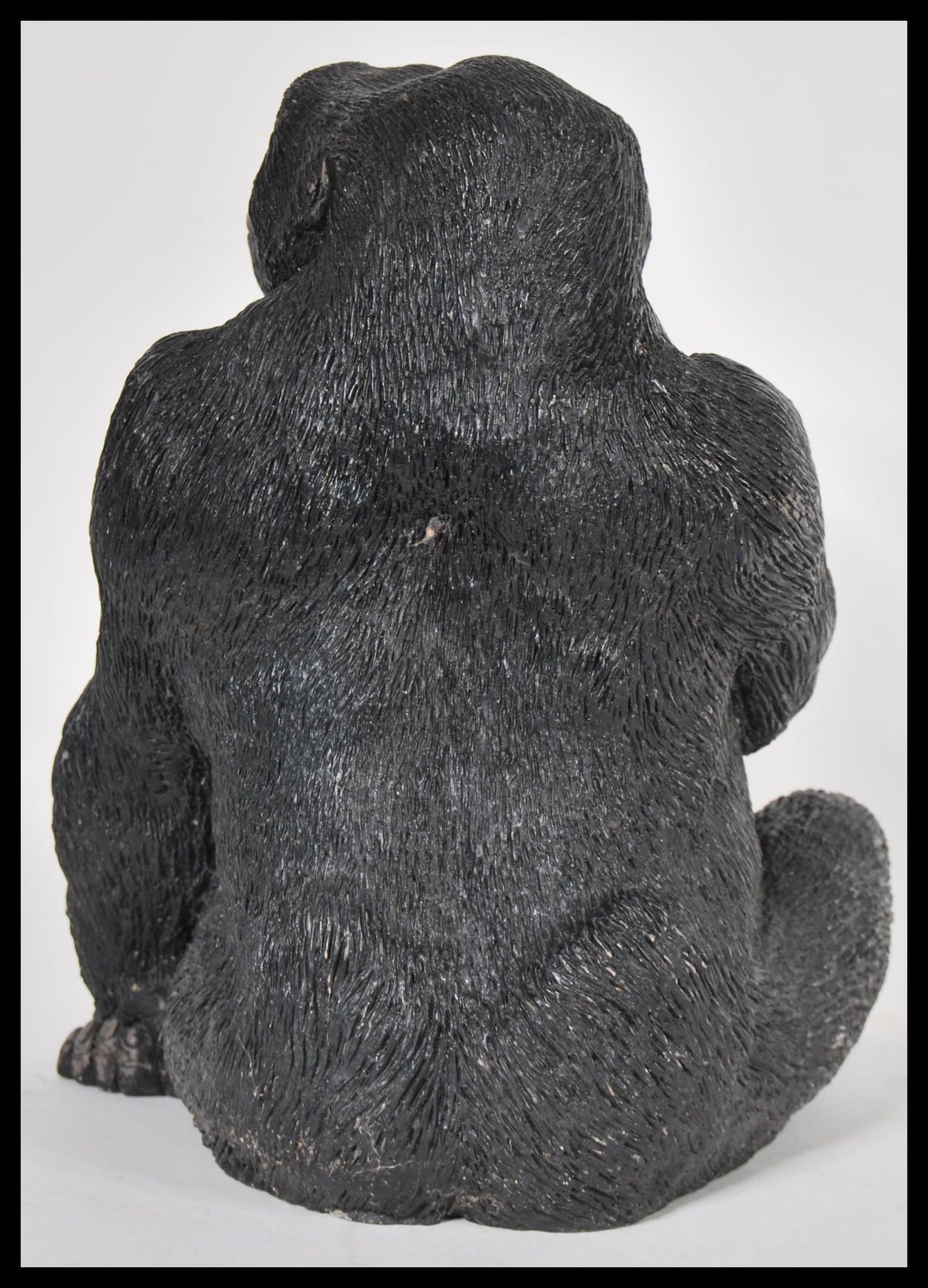 A 20th Century resin figurine in the form of a sitting gorilla, bearing the makers mark Carn to - Bild 3 aus 4