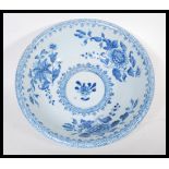 A 19th Century Chinese porcelain bowl having hand painted blue and white decoration depicting floral
