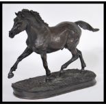 A 20th Century contemporary bronzed / bronze effect figurine depicting an Arab horse raised on