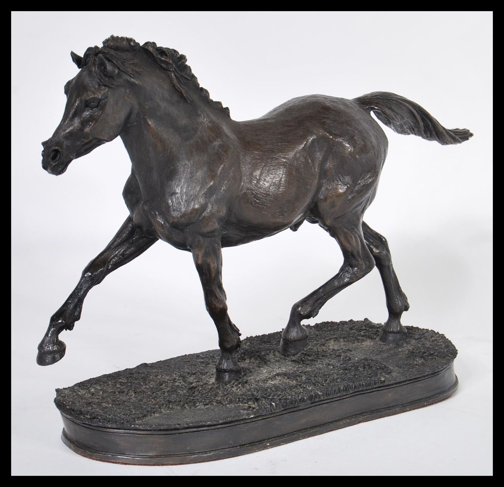 A 20th Century contemporary bronzed / bronze effect figurine depicting an Arab horse raised on