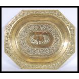 An early 20th century circa 1900 Indian brass tray depicting an elephant to the central panel. The