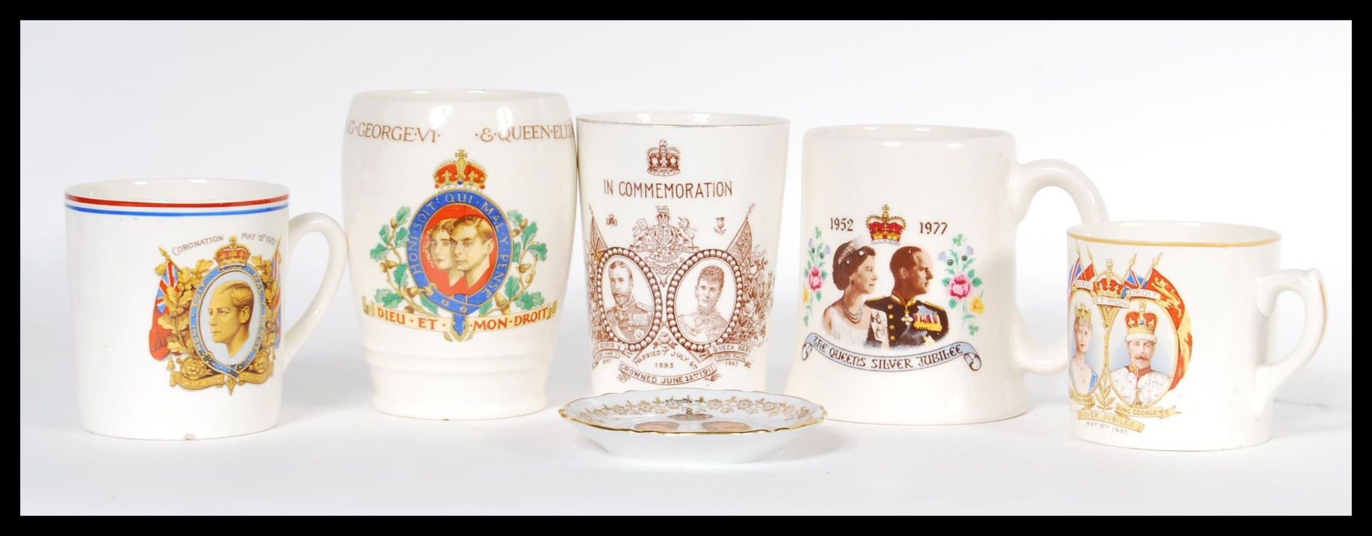 A collection of early 20th century Art Deco ceramic commemorative wears to include a 1911 beaker for