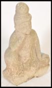 A well weathered garden reconstituted stone figure of Buddha Seated in vajra position, hands cast in