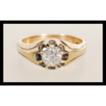 A marked 9ct gold and diamond ring, the diamond approx 3pnts. Marked 9ct gold. Weight 5.7g. Size T.