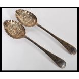 A pair of Edwardian silver hallmarked Walker and Hall berry spoons. Sheffield assay marks and dating