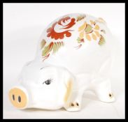 A vintage 20th Century 1960's large ceramic money bank box in the form of a pig having hand