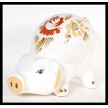 A vintage 20th Century 1960's large ceramic money bank box in the form of a pig having hand