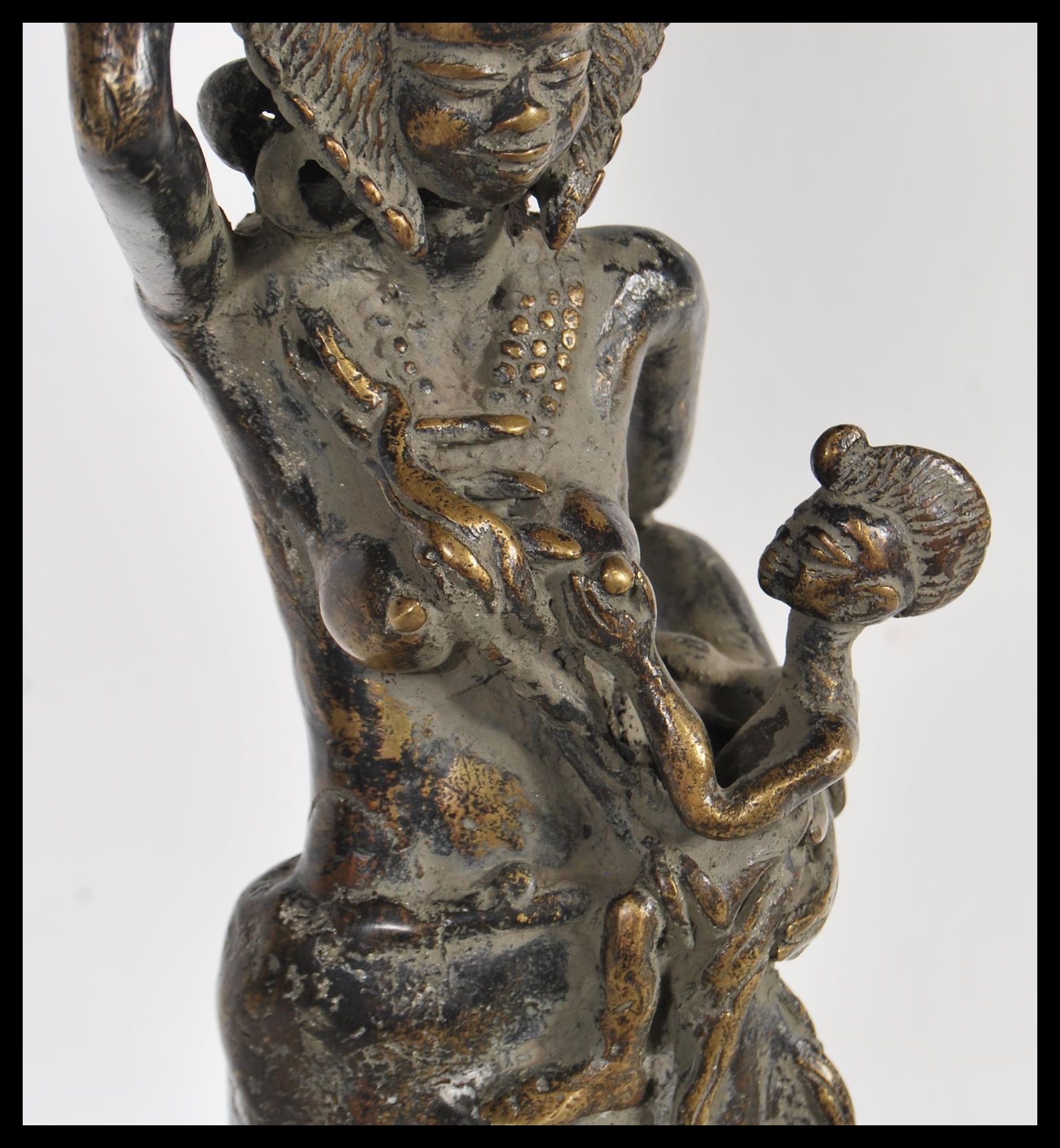 A 20th Century African fertility bronze figure, the figure raised on a circular base of a mother - Image 3 of 7