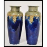 A pair of Royal Doulton baluster vases, circa 1930, decorated with a two tone blue and grey/green