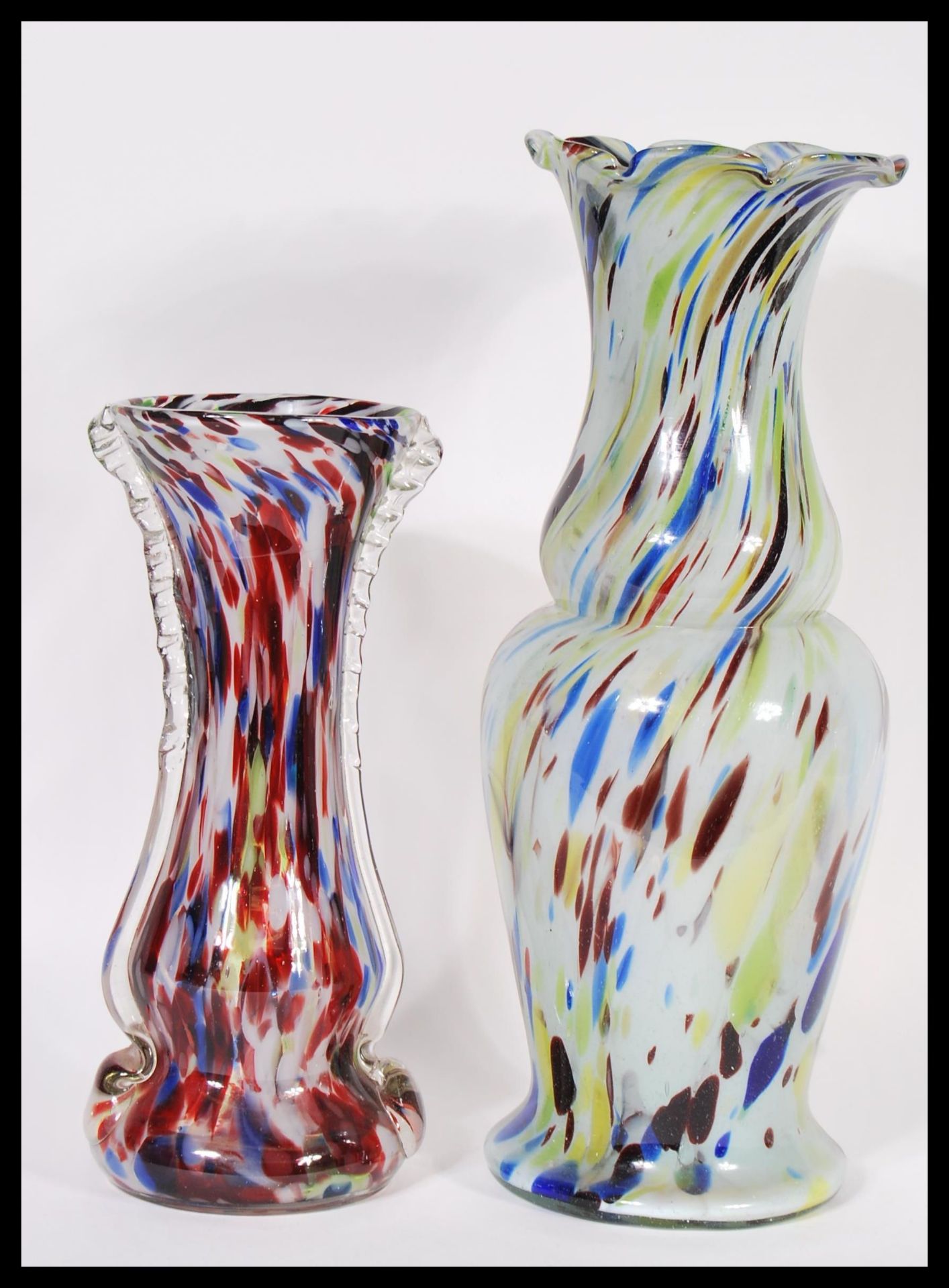 Two vintage 20th Century studio glass baluster vases by Murano to include a mottled vase with flared