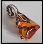 A vintage large amber necklace pendant having a sterling silver 925 necklace mount. Total weight