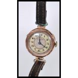 An early 20th Century hallmarked 9ct gold watch having a silvered dial with mother of pearl