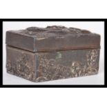 A 19th Century Chinese white metal snuff box / pill pot having relief decoration depicting a