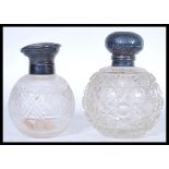 Two 19th Century Victorian hallmarked silver lidded and cut glass perfume bottles of globular