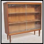 A retro mid 20th century teak wood scratch built glazed fronted bookcase, two full front glazed