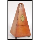 A 20th Century vintage French metronome marked 'Metronome De Maelzel', of typical wooden form,