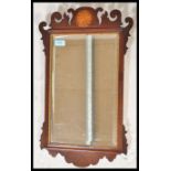 A 19th Century Victorian mahogany pier mirror having a central bevelled glass panel with scrolled