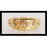 A 19th Century Victorian 18ct gold ring set with a central diamond in a gypsy setting having