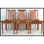 A set of six vintage retro 20th Century G Plan teak dining chairs raised on shaped legs with bergere