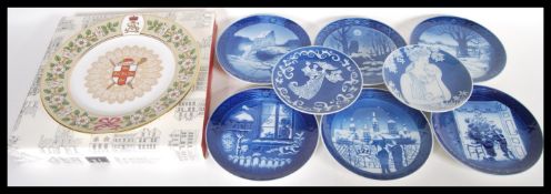 A collection of Royal Copenhagen collectors ceramic plates to include mostly blue and white examples