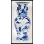 A 19th Century Chinese hand painted blue and white porcelain vase of baluster form having waisted