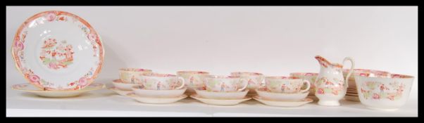 A Victorian 19th Century English Staffordshire tea set consisting of tea cups, saucers, side plates,