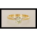 An 18ct carat gold single stone diamond solitaire ring having an old cut diamond of approx 50 pts.