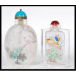 Two 20th Century Chinese glass perfume bottles one of ovoid form with frosted glass body, bird of